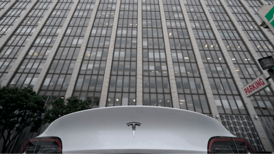 A Tesla car is parked in a lot across the street from a federal courthouse in San Francisco, Wednesday, Jan. 18, 2023.