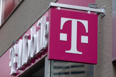 The T-Mobile logo is seen on a storefront, Oct. 14, 2022, in Boston. The U.S. wireless carrier T-Mobile said Thursday, Jan. 19, 2023, that an unidentified malicious intruder breached its network in late November and stole data on 37 million customers, including addresses, phone numbers and dates of birth.