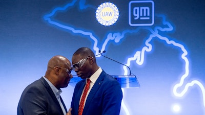 UAW President Ray Curry, left, speaks privately with Lt. Gov. Garlin Gilchrist after a news conference on Friday, Jan. 20, 2023.