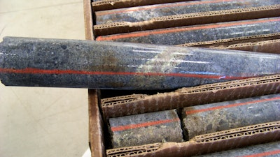 In this Oct. 4, 2011, file photo, a core sample drilled from underground rock near Ely, Minn., shows a band of shiny minerals containing copper, nickel and precious metals, center, that Twin Metals Minnesota LLC, hopes to mine near the Boundary Waters Canoe Area Wilderness in northeastern Minnesota.