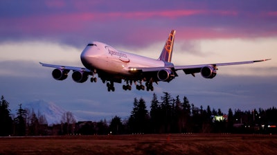 The final Boeing 747 lands at Paine Field following a test flight, Tuesday, Jan. 10, 2023, in Everett, Wash.