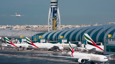 An Emirates jetliner comes in for landing at the Dubai International Airport in Dubai, United Arab Emirates, Dec. 11, 2019.