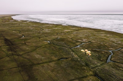 This Sunday, June 30, 2019, aerial photo released by Earthjustice shows the Alaska's North Slope in the Western Arctic on the edge of Teshekpuk Lake, Alaska.