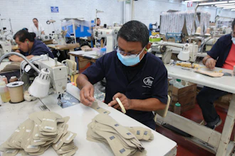 A man works in a shoe maquiladora or factory, in Leon, Mexico, Monday, Feb. 7, 2023.