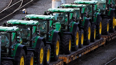 A consist of John Deere tractors sit in Norfolk Southern's Conway Yard in Conway, Pa., Monday, Dec. 5, 2022. On Thursday, the Labor Department releases the producer price index for January, an indicator of inflation at the wholesale level that's closely monitored by the Federal Reserve.