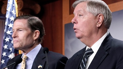 Sen. Lindsey Graham, R-S.C., right, Sen. Richard Blumenthal, D-Conn., left, speak during a news conference on legislation labeling the Russian Wagner Group as one of the Foreign Terrorist Organizations, Thursday, Feb. 16, 2023, on Capitol Hill in Washington.
