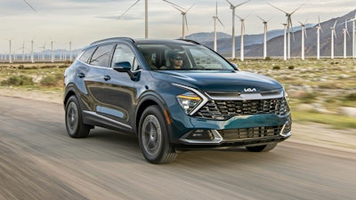 This photo provided by Kia shows the 2023 Kia Sportage, a compact SUV with a first-time hybrid variant.