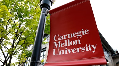 A Carnegie Mellon University sign is displayed outside Baker Hall on the university's campus in Pittsburgh, June 7, 2019.