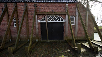 Support beams stabilize an historic farm in Hunzinge, northern Netherlands, on Jan. 19, 2018.