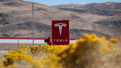 A sign marks the entrance to the Tesla Gigafactory in Sparks, Nev., on Oct. 13, 2018.