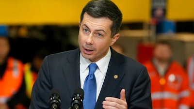 Transportation Secretary Pete Buttigieg speaks before the arrival of President Joe Biden at the construction site of the Hudson Tunnel Project, Tuesday, Jan. 31, 2023, in New York. Nearly 50 businesses and nonprofits including rideshare companies Uber and Lyft, industrial giant 3M and automaker Honda are pledging millions of dollars in initiatives to stem a 'crisis' in road fatalities under a new federal effort announced Friday, Feb. 3.