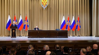 Russian President Vladimir Putin delivers his speech during a meeting of the Federal Security Service (FSB) board as Federal Security Service (FSB) director Alexander Bortnikov sits next in Moscow, Russia, Tuesday, Feb. 28, 2023.