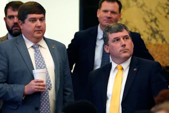 Republican Sens. Jeremy England, R-Vancleave, left, and Daniel Sparks of Belmont, listen as the Senate Clerk tallies the vote on a bill that would place new restrictions on car manufacturers for opening brick-and-mortar car dealerships, following a long floor debate in the Chamber at the Mississippi Capitol in Jackson, Thursday, March 2, 2023.