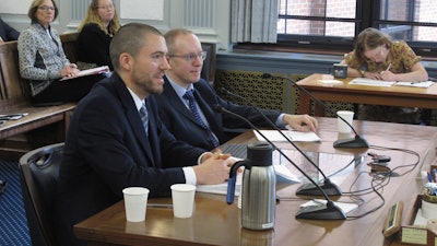 Dan Stickel, chief economist with the Alaska Department of Revenue's tax division, left at table, speaks to the Senate Finance Committee as part of a presentation on the major North Slope oil project known as the Willow project on Thursday, March 23, 2023, in Juneau, Alaska. Seated next to Stickel is Owen Stephens with the tax division.