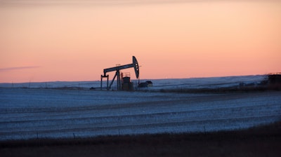 A pump jack for pulling oil from the ground is seen near New Town, N.D., Feb. 25, 2015. On Monday, March 27, 2023, a federal judge ordered the United States government to resume oil and gas lease sales on federal lands in North Dakota as a legal battle continues over the Biden administration's pause on the federal leasing program two years ago in an effort to combat climate change.