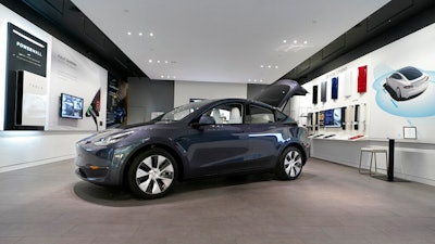 A Tesla Model Y Long Range is displayed on Feb. 24, 2021, at the Tesla Gallery in Troy, Mich. U.S. auto safety regulators have opened an investigation into Tesla’s Model Y SUV after getting two complaints that the steering wheels can come off while being driven. The National Highway Traffic Safety Administration says the probe covers an estimated 120,000 vehicles from the 2023 model year.