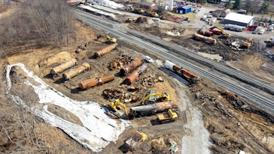 A view of the scene Friday, Feb. 24, 2023, as the cleanup continues at the site of a Norfolk Southern freight train derailment that happened on Feb. 3, in East Palestine, Ohio. On Tuesday, Feb. 28, in the wake of a fiery Ohio derailment and other recent crashes, federal regulators urged that freight railroads should reexamine the way they use and maintain the detectors along the tracks that are supposed to spot overheating bearings.