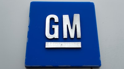 The General Motors logo is displayed outside the General Motors Detroit-Hamtramck Assembly plant, Jan. 27, 2020, in Hamtramck, Mich.