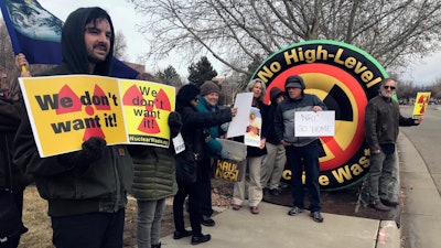 Brendan Shaughnessy, left, with the Nuclear Issues Study Group, protests with other activists ahead of a meeting of a U.S. Nuclear Regulatory Commission panel in Albuquerque, N.M., on Tuesday, Jan. 22, 2019.