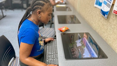 Oryanan Lewis works in the computer lab at Chattahoochee Valley Community College in Phenix City, Ala., on Feb. 23, 2023.