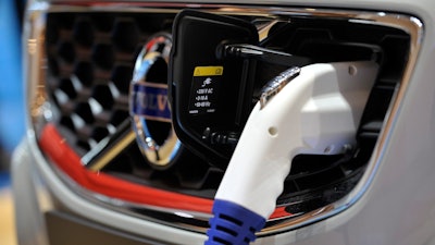 A plug connector used for charging an electric car during the press day at the 81st Geneva International Motor Show in Geneva, Switzerland, Wednesday, March 2, 2011.