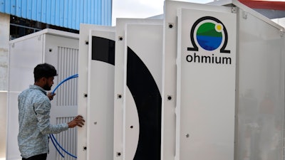 A technician conducts tests on the electrolyzer hydrogen module at the Ohmium manufacturing facility in Chikkaballapur, outside Bengaluru, India, Tuesday, April 25, 2023.