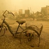 A trike stands near the burnt remains of a building destroyed by a wildfire near the Lake Detroit Market in Detroit, Ore., Sept. 11, 2020.