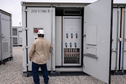 An employee works at a battery energy storage facility in Saginaw, Texas, April 25, 2023, that is owned and operated by Eolian L.P.