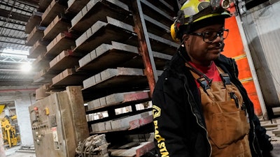A stack of concrete blocks created with liquid carbon dioxide as an ingredient is pulled from a curing kiln at the Glenwood Mason Supply Company, Tuesday, April 18, 2023, in the Brooklyn borough of New York.