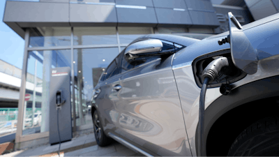 A BYD ATTO 3 electric sports utility vehicle gets charged as it is displayed at a BYD dealership on April 4, 2023, in Yokohama near Tokyo.