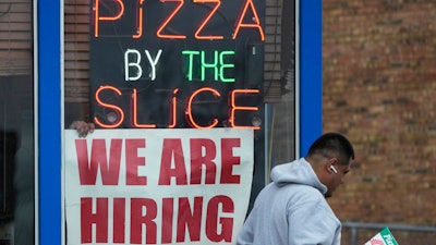 A hiring sign displayed at a restaurant in Prospect Heights, Ill., April 4, 2023.