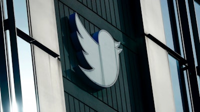 A Twitter logo hangs outside the company's offices in San Francisco, Dec. 19, 2022. Elon Musk said Thursday, May 11, 2023, that he has found a new CEO for Twitter, or X Corp. as it is now called.