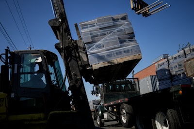 A forklift operates a load of concrete blocks, made with liquid carbon dioxide as an ingredient, onto trucks at the Glenwood Mason Supply Company, Tuesday, April 18, 2023, in the Brooklyn borough of New York.