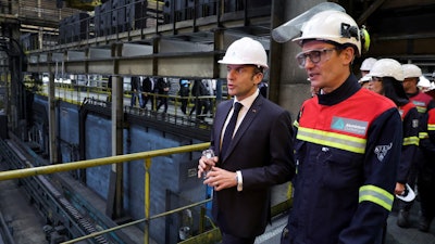 French President Emmanuel Macron visits the Aluminium Dunkerque factory in Dunkirk, northern France, Friday, May 12, 2023.
