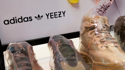 A sign advertises Yeezy shoes made by Adidas at Kickclusive, a sneaker resale store, in Paramus, N.J., Tuesday, Oct. 25, 2022.
