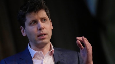 OpenAI's CEO Sam Altman gestures while speaking at University College London as part of his world tour of speaking engagements in London, on May 24, 2023.
