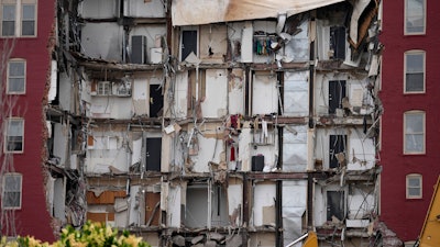 Seen is the damage from a collapsed apartment building, Monday, June 5, 2023, in Davenport, Iowa.