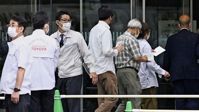 Visitors enter the venue of Toyota shareholders' meeting in Toyota city, Aichi prefecture, central Japan, Wednesday, June 14, 2023.