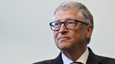 Bill Gates reacts during a visit with Britain's Prime Minister Rishi Sunak at the Imperial College University, in central London, on Feb. 15, 2023.