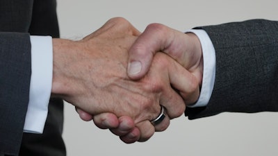 German Chancellor Olaf Scholz, right, and Intel CEO Pat Gelsinger, left, shake hands after the signing ceremoy of an agreement between the German government and the company at the Chancellery in Berlin, Germany, Monday, June 19, 2023.
