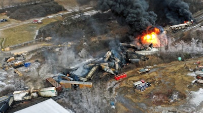 In this photo taken with a drone, portions of a Norfolk Southern freight train that derailed the previous night in East Palestine, Ohio, remain on fire at mid-day, Feb. 4, 2023.
