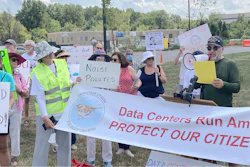 Dale Browne, president of the Great Oak Homeowners Association, speaks Aug. 29, 2022, at a rally near Manassas, Va., protesting a newly built data center for Amazon Web Services.