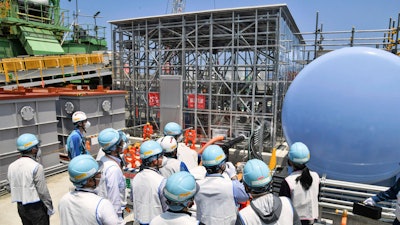 An equipment to be used to dilute the water with seawater is shown to media at the Fukushima Daiichi nuclear power plant in Fukushima, northern Japan, Monday, June 26, 2023.
