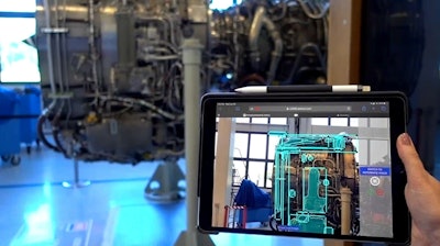 The Percept tool scanning a V2500 engine on a mobile device.