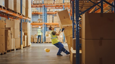 Shot Of A Warehouse Worker Has Work Related Accident He Is Falling Down Before Trying To Pick Up Heavy Cardboard Box From The Shelf Hard Injury At Work 1284193571 1369x770 (1)