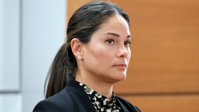 Melina Hipskind, from McDonalds USA, stands at the defense table as a verdict awarding Philana Holmes and Humberto Caraballo Estevez $800,000 on behalf of their daughter Olivia Caraballo, now 8, is read at the Broward County Courthouse in Fort Lauderdale on Wednesday, July 19, 2023.