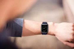 Hand Wearing Elegant Smartwatch 000059808722 Small