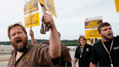 UPS teamsters and workers hold a rally, Friday, July 21, 2023, in Atlanta, as a national strike deadline nears.