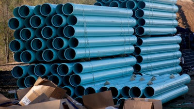 Drainage pipe is stacked at a construction site for a housing development on Oct. 19, 2017 in Jackson Township, outside Zelienople, Pa.