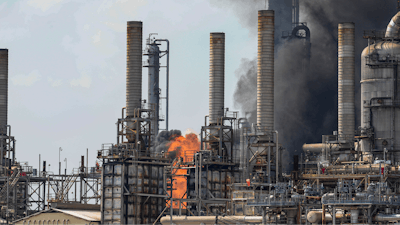 A fire burns at a Shell chemical facility in Deer Park, Friday, May 5, 2023, east of Houston. Texas is suing Shell and is seeking more than $1 million, alleging a fire at the oil giant's Houston-area petrochemical plant damaged the environment.